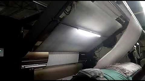 Open width compacting machine.