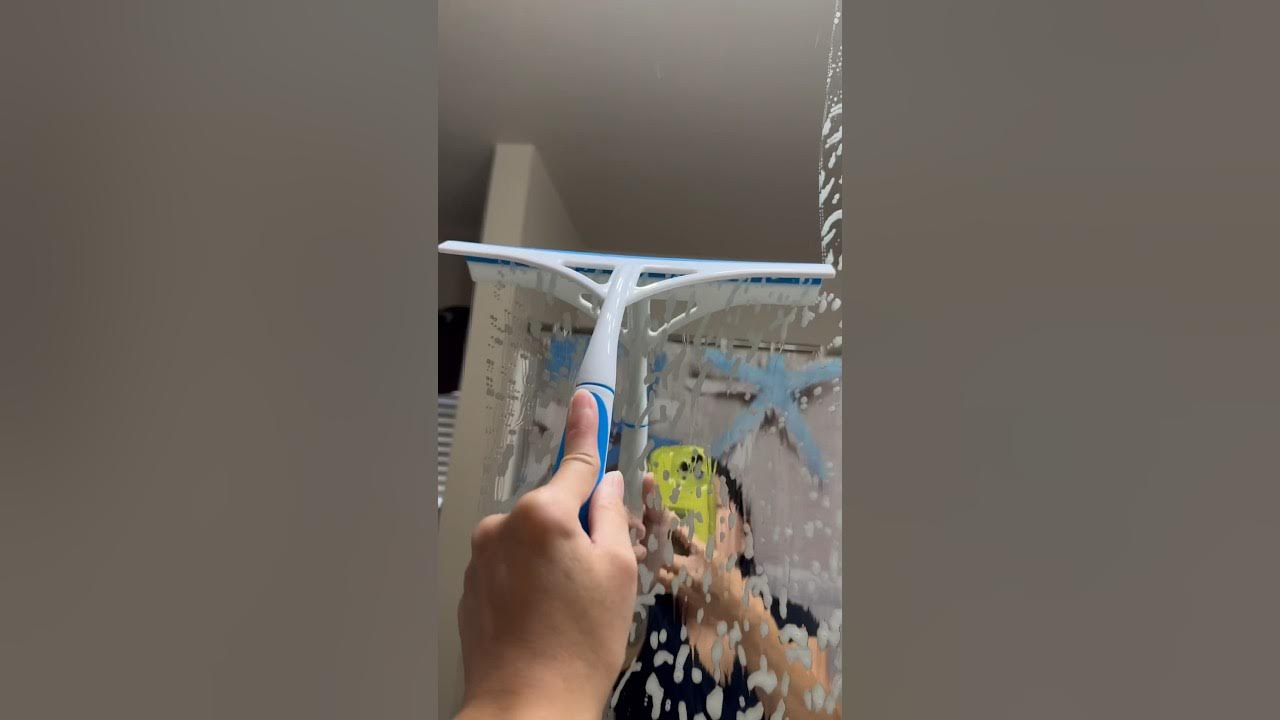 Cleaning The Bathroom Mirror With Dollar Tree Squeegee. dollartree 