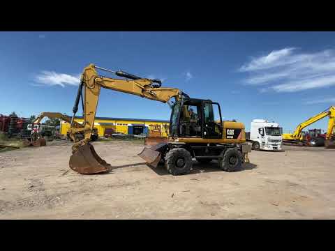 Колёсный экскаватор Caterpillar