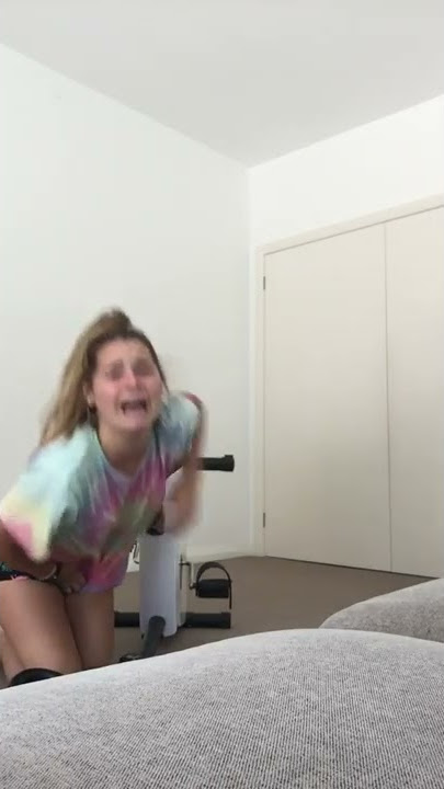 girl falls off exercise bike