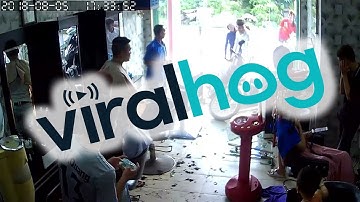 Out of Control Scooter Smashes Into Barbershop || ViralHog