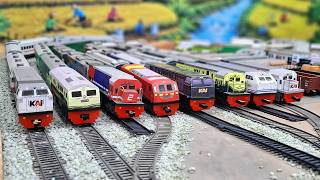 A group of Indonesian toy trains suffered a series of collisions, causing them to fall off the ra...