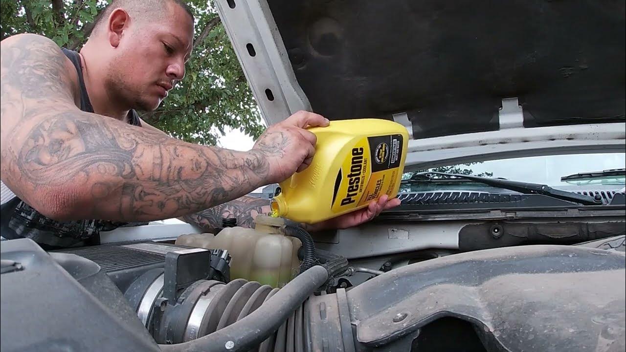topping the cars off with antifreeze - YouTube