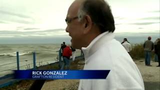 Spectators gather to watch crashing waves