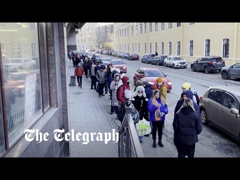 Russians queue for cash as sanctions cause rouble to tumble | Ukraine crisis