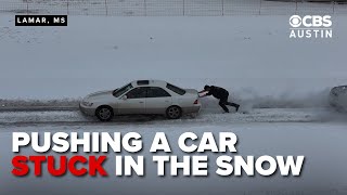 Stuck on ice: Bystander helps stranded driver in Lamar, Mississippi