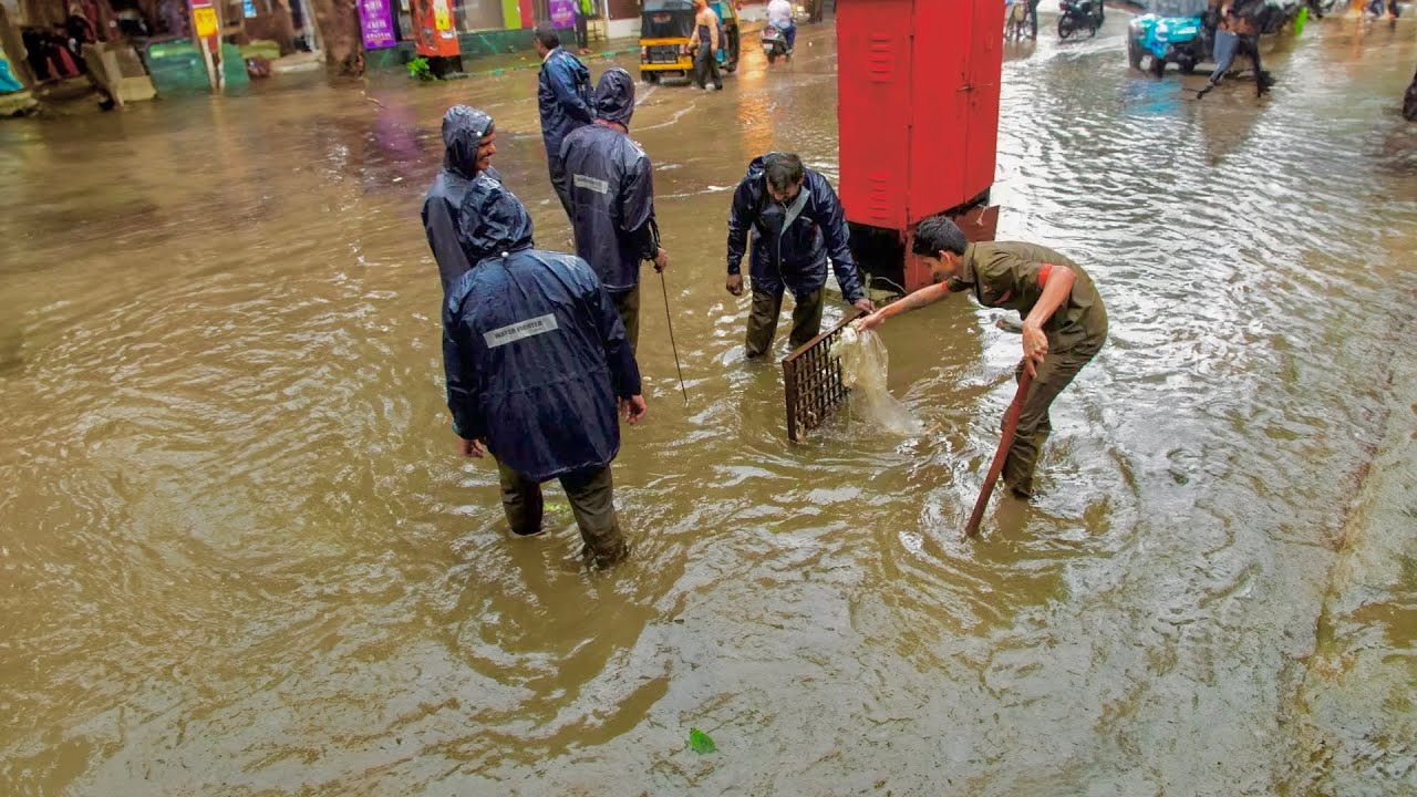 Clearing the Way Unclogging Flooded Street Drains for Flood Control ...