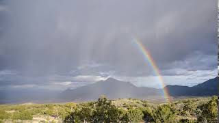 Timelapse of desert storm and rainbow