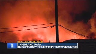 Warehouse still smoldering, several Highland Park schools closed