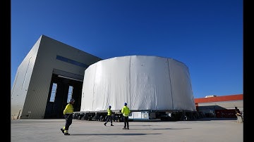 Cocooned Cryostat Lower Cylinder moves into temporary storage