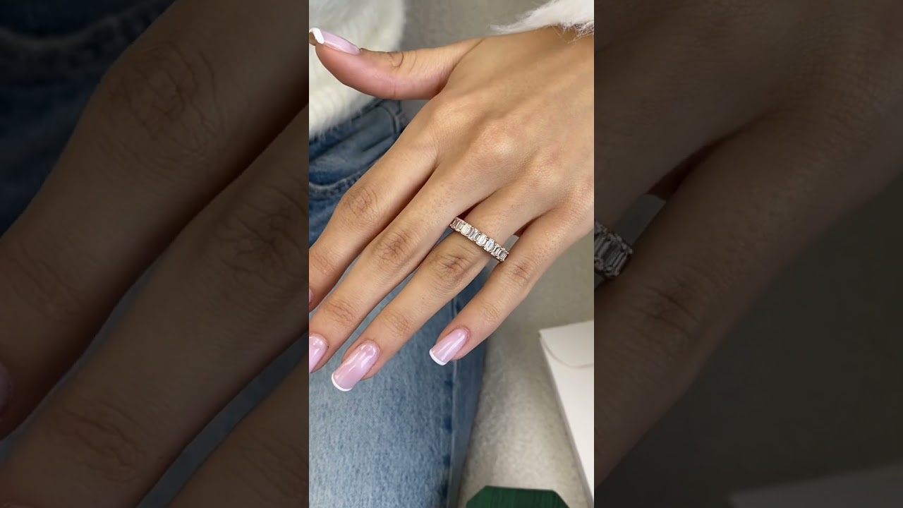 Rose gold emerald cut diamond eternity band 