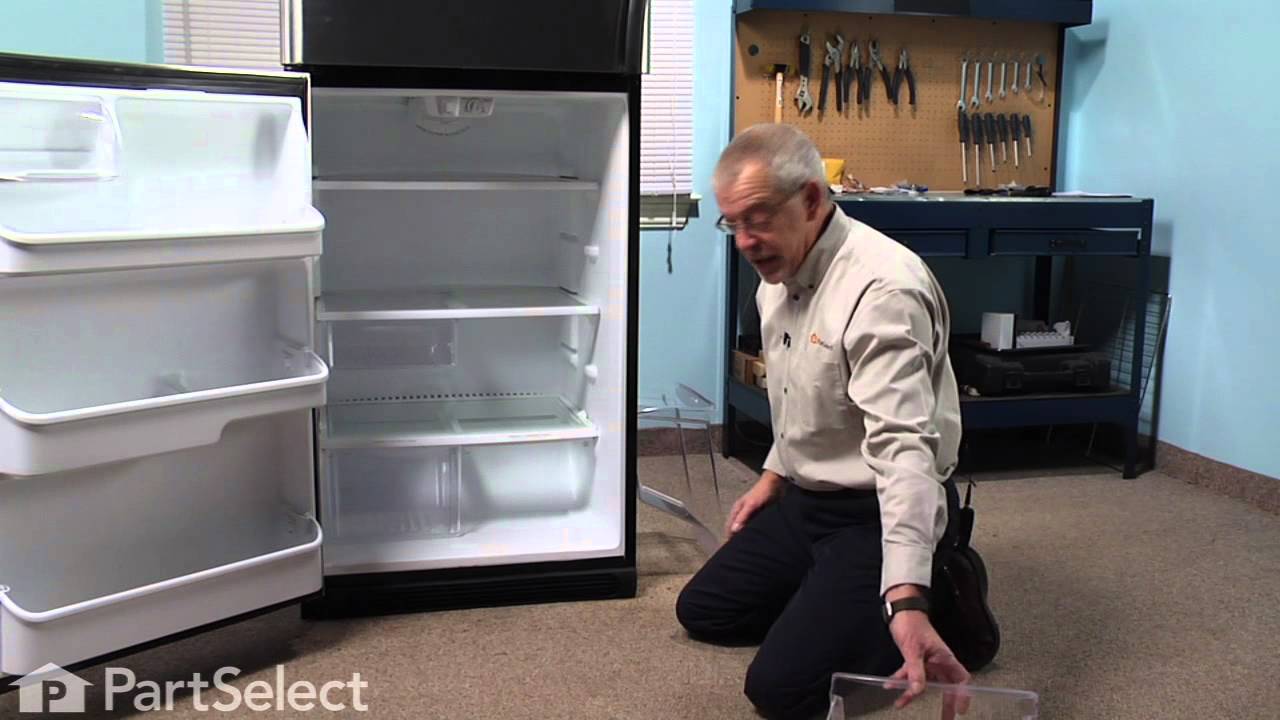 How do you remove the drip pan from a refrigerator?