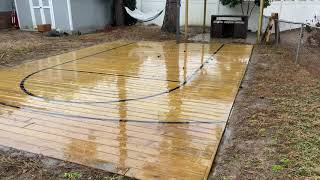 Wooden outdoor Basketball court 1 year later.