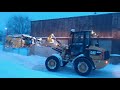 CAT 908M Wheel Loader plowing snow with Metal Pless snow plow