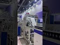 High speed interleaved draw tape garbage bag making machine