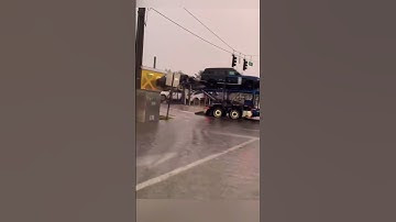 Unstoppable Force: Train Collides with Car-Laden Trailer