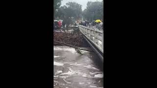 Floodwater Rages as Severe Storms Wreak Havoc on Coastal Community