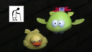 Grandad plays with bath time toys Duck & Frog