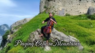 Mountain Melodies: Hauser's Serene Cello Performance Amidst Majestic Peaks! 🏔️🎻