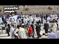 Prayerful people in the Wailing Wall In Jerusalem