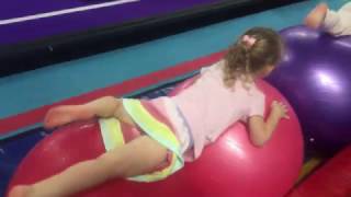 CRAWLING ON MEDICINE BALLS AT GYMNASTICS