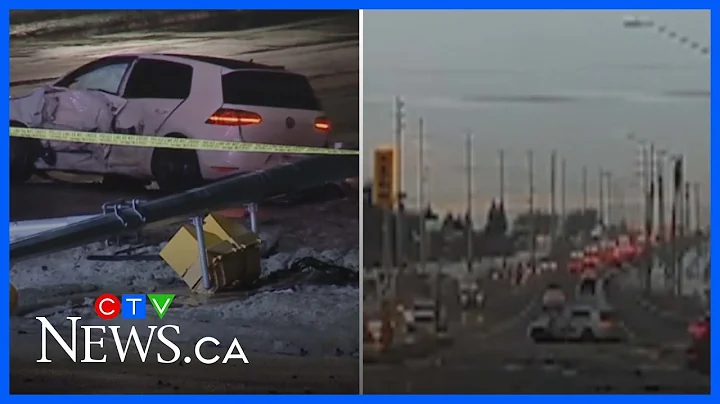 Watch dashcam footage of two cars colliding and knocking down traffic light
