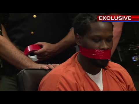 Man`s mouth duct taped hearing