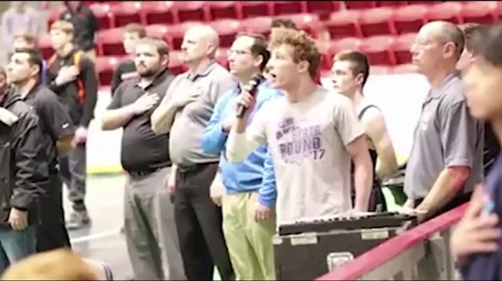 High school wrestler sings the National Anthem at ...