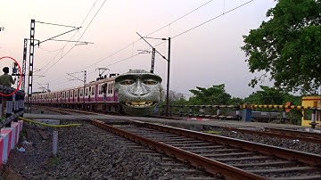 Chimpanzee headed katwa Howrah local emu cross curve railway gate