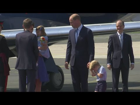 Bless you! Prince George shakes off sneeze as royals are welcomed to Germany