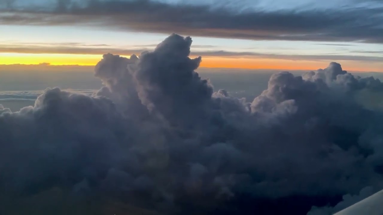 Flying through gorgeous cumulous clouds at sunset - available for free use