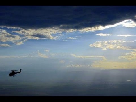 HELICOPTER AND THUNDERSTORM - UNUSUAL EVENT