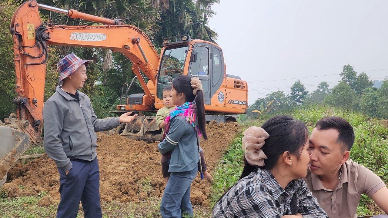 Hong Thai and Nam worked together to level the land in preparation for building a new house.