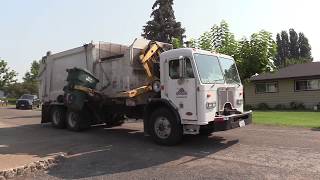 Peterbilt 320 Heil DP7000