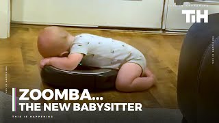 Baby Rests Torso Over Robotic Vacuum Enjoying The Spin Ride