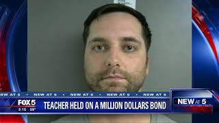 Teacher held on a million dollars bond