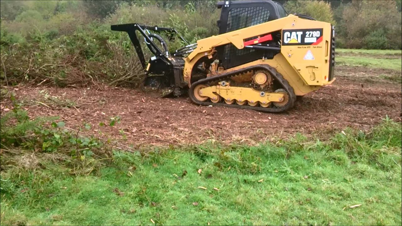 Cat 279D and HM315B Mulching head YouTube