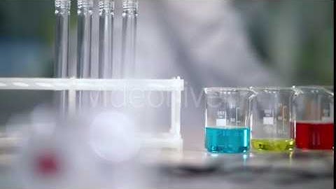 Lab Worker Put Test Tubes Rack on Laboratory Table. Laboratory Glassware | Stock Footage - Videohive