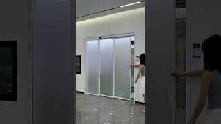 This is a triple-panel PD door system.All panels link and move smoothly to open a wider passage.