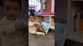 Learning to read ! Calgary Public Library! 11 months old