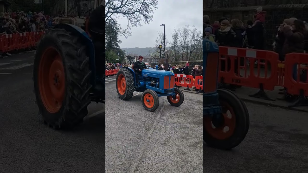 Top man Joe Seels leading the tractors through Pateley Bridge.