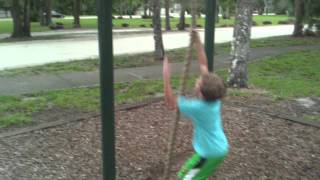 Climbing The Rope At The Park