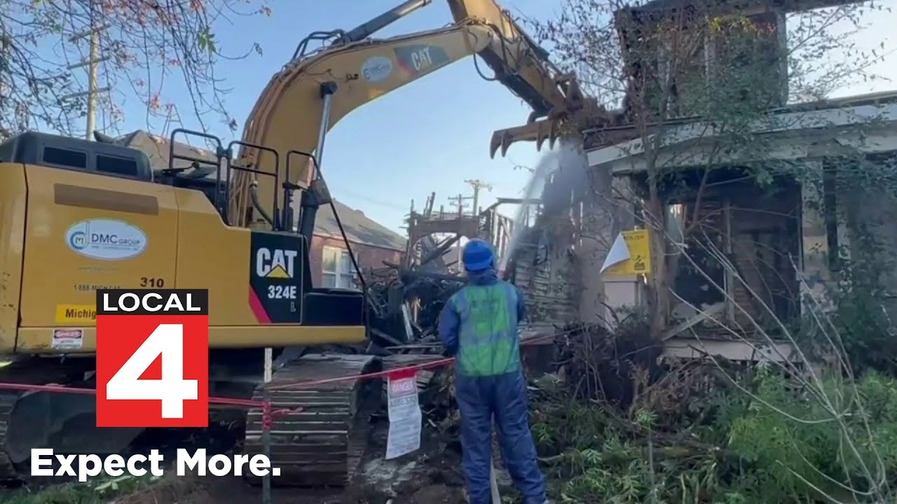 Demolition crews knock down vacant Detroit house after fire spreads to ...