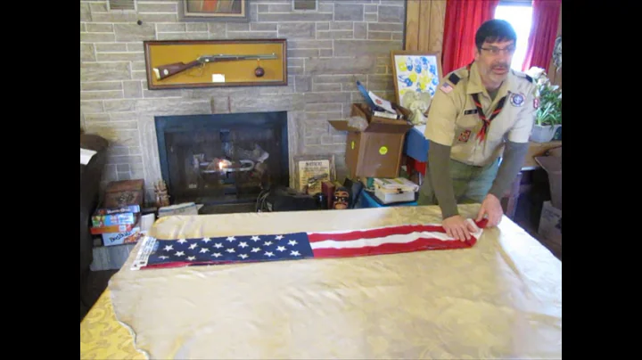 What the each fold represents when folding the American Flag with Cubmaster Chris