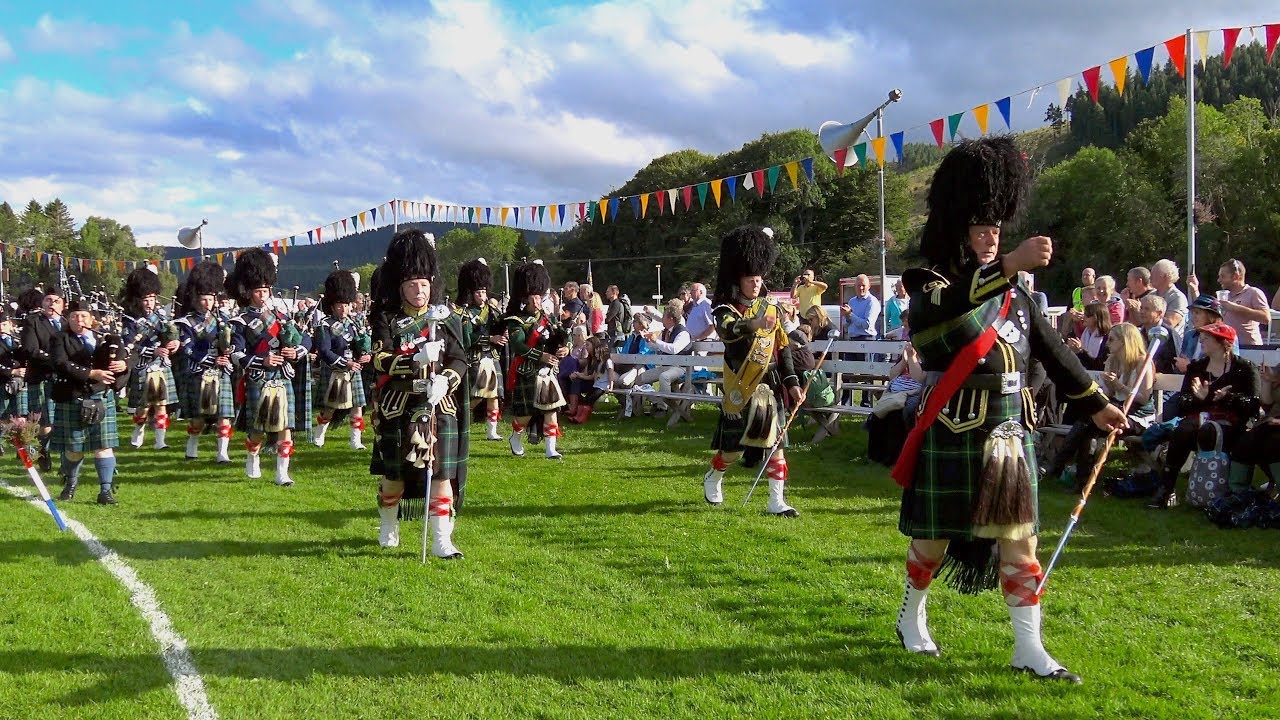 Lonach Games 2017 Massed Pipe Bands parade with Mace display by Drum