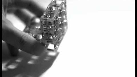 High-speed videos of centimeter-scale SoftCube prototype self-assembling the original 3D shape.