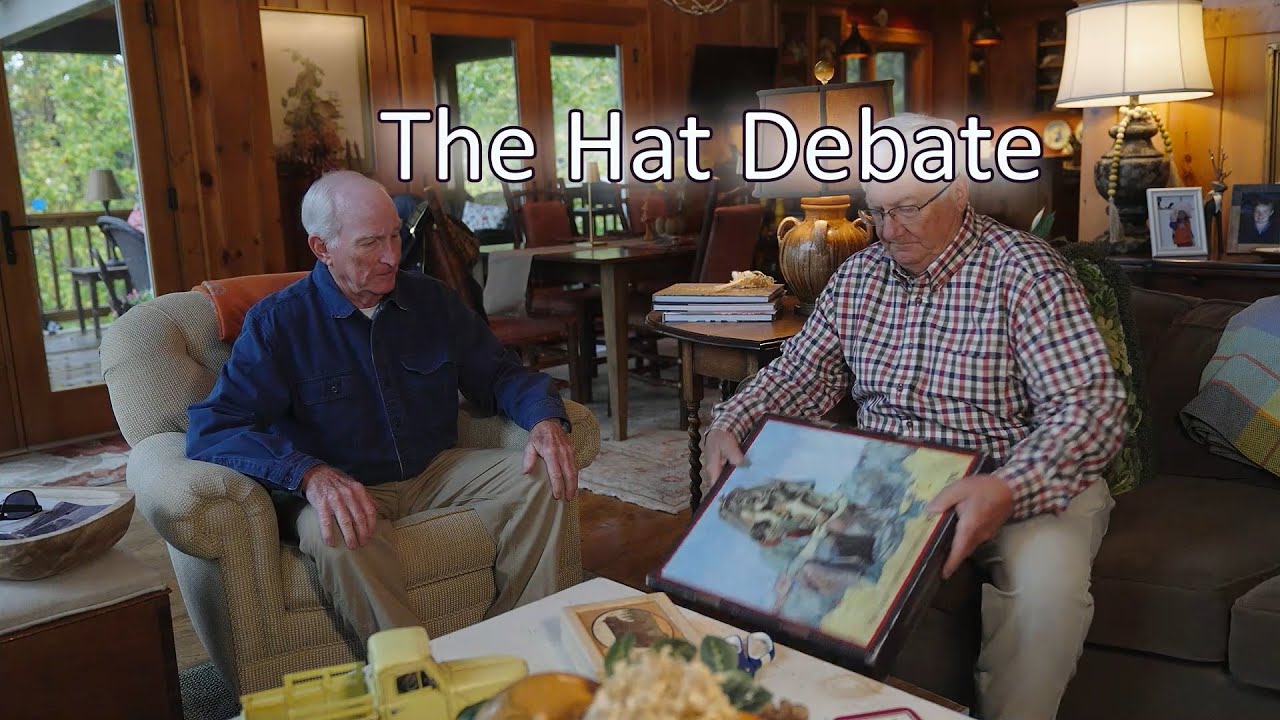 The Hat Debate   by John Rob Holland