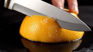 ASMR Video Prompt 5: Hyper Realistic ASMR Macro – Using a Knife on a Frozen Grapefruit Shot: Ex...