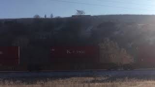 Stack train at milepost 989 led by C45ACCTE 7933 in Riverdale Utah