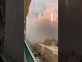 Rocket Launch Amidst Urban Chaos: A Tense Moment #RocketLaunch #MiddleEastConflict